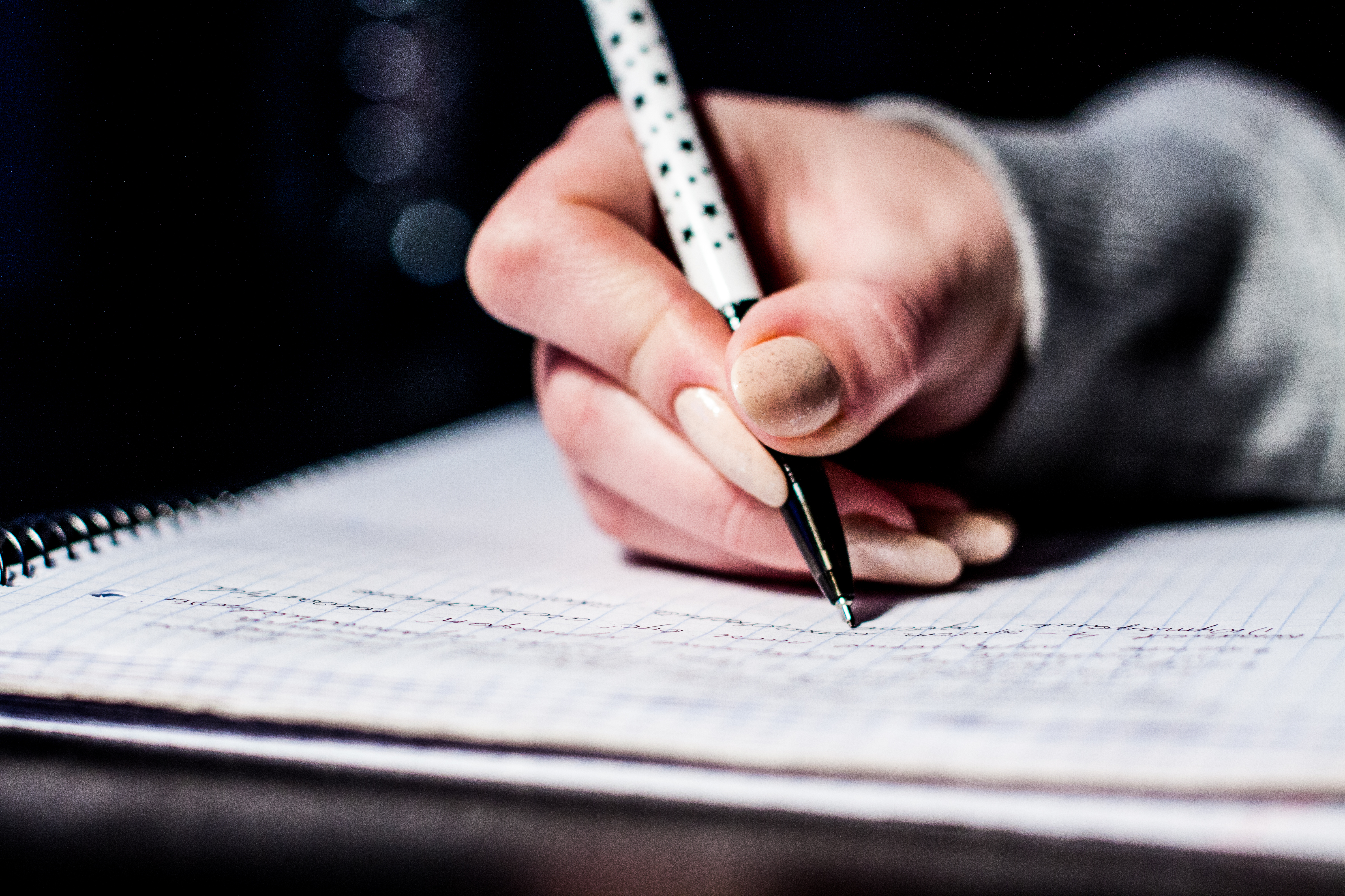 Taking organized notes with pen and notebook